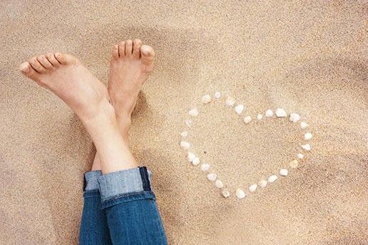 Feet in a beach setting